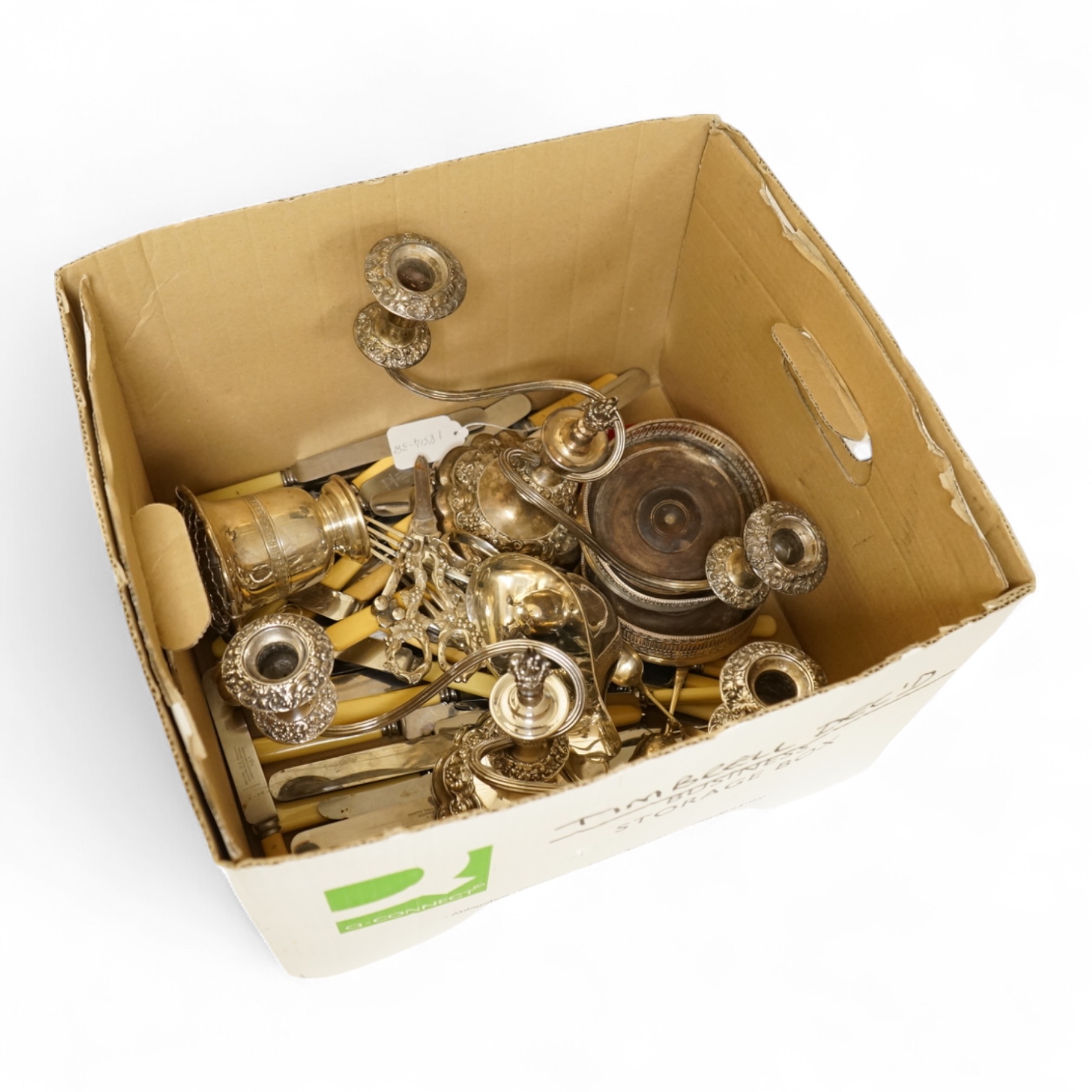 A group of sundry plated items including dwarf candelabra, a pair of wine coasters, a pair of grape shears, etc., and a quantity of assorted ivorine handled table and dessert knives.